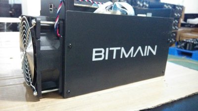 A close up of a mining rig showing multiple GPUs and cooling fans, highlighting the heat dissipation challenges in cryptocurrency mining.